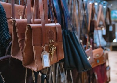 leather purses hung for sale