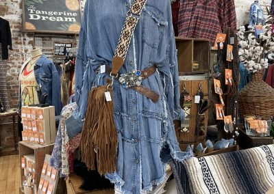 denim skirt and frilled purse on display for sale