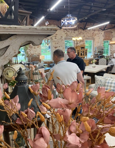 Two men browsing items in an antique shop