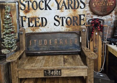 Vintage Studebaker tailgate bench in rustic store