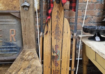 Vintage wooden skis with plaid bow decoration