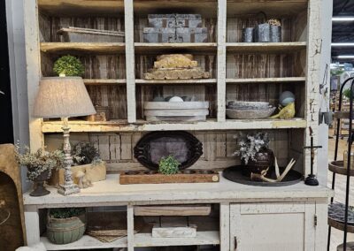 Vintage rustic cupboard with decorative items displayed