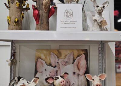 Decorative ceramic pigs on display in a store