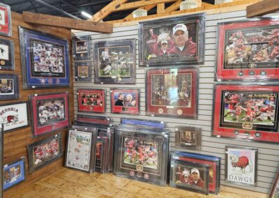 Sports memorabilia collection displayed on rustic wall.