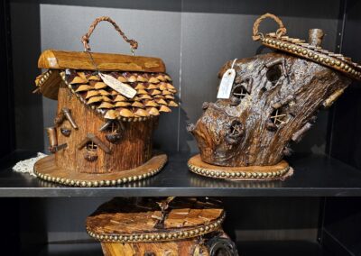 Wooden purses displayed on glass shelves