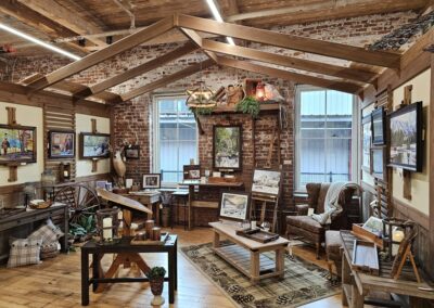 Rustic art studio with exposed brick and beams.