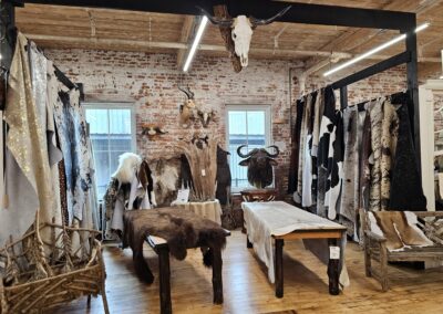 Vintage boutique interior with animal hides and skulls.