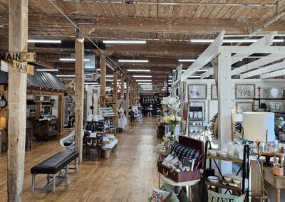 Antique furniture store interior with wooden floor aisles.